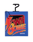 Blue box with "Bowie" and a red lightening bolt on it; package for socks with same pattern.