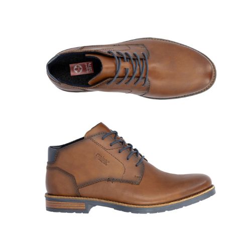 14612 Dress Boot shown in tan genuine leather with navy laces, featuring an ankle-high design, sleek silhouette, and durable rubber outsole. Top and side view displaying classic chukka boot styling with contrast stitching and layered heel construction.