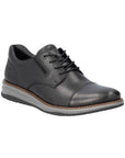 14701 Lace-Up Sneaker shown in black leather with contrast brown stitching and sole detail, styled with dark denim jeans. Features classic oxford design with clean lines, cushioned grey midsole, and durable rubber outsole for versatile casual to formal wear.