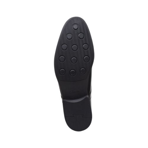 Black rubber outsole with circle tread pattern/