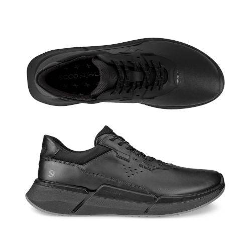 A pair of black sneakers with Ecco branding visible on the tongue, the insole, and around the heel. 