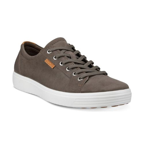 A light grey nubuck casual sneaker with a white midsole and brown outsole. A brown leather tag near the laces show the Ecco logo. 