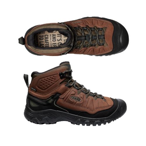 Top and side view of Targhee IV Hiker Boot. Black rubber outsole is built up around toe. Insole is beige with black lettering. 