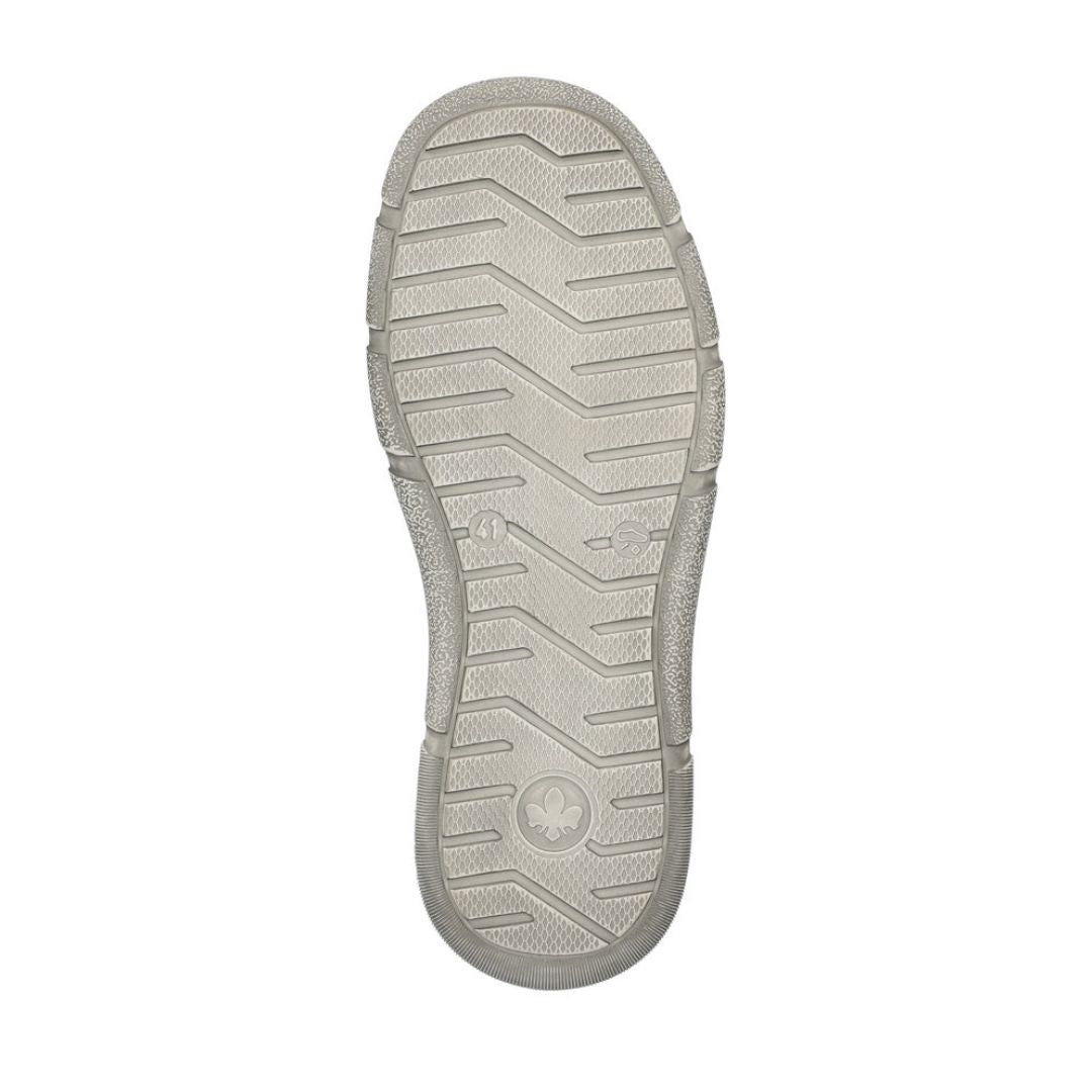 Bottom view of 04051 Slip-On Shoe showing light gray rubber outsole with zigzag traction pattern and circular brand logo, featuring durable non-slip grip design for reliable traction and stability.