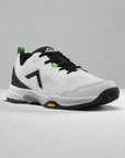 White and black pickleball shoe with green accents, unique logo, textured sole, and Vibram rubber outsole.