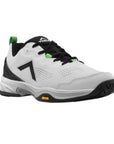 A white pickleball shoe with a vibrant Vibram rubber outsole design and black and green accents.