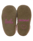 Brown suede outsole with pink stitching that says little peanut on it. Robeez logo imprinted on heel.