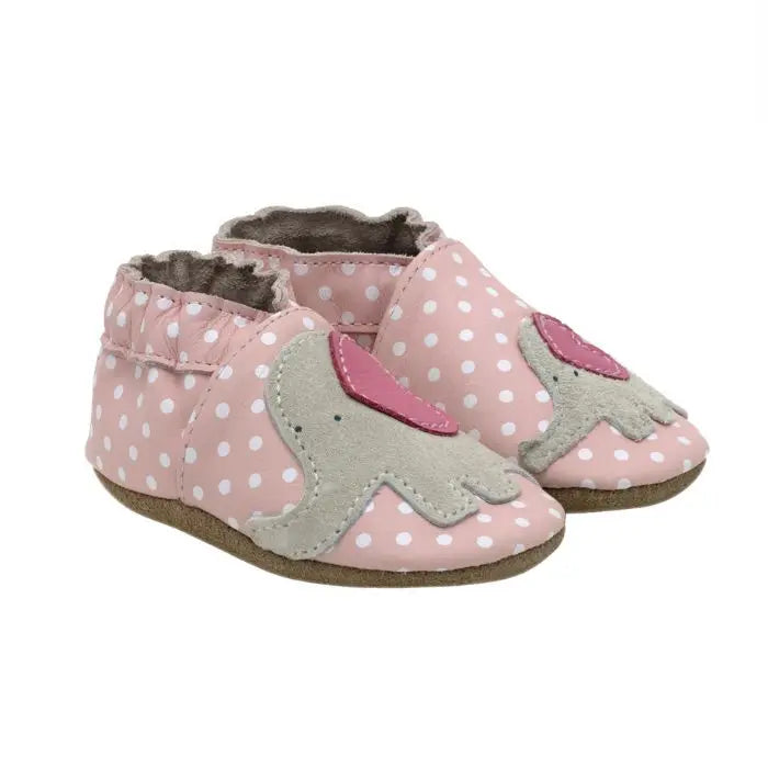 Pink leather shoes with white polka dots and an elephant design on top.