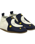 Navy and cream leather baby shoes with moon and star design.