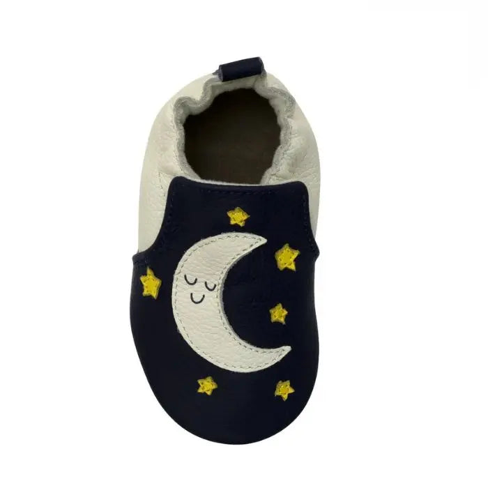 Navy and cream leather baby shoes with moon and star design.