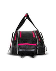 A black and pink duffel bag with a wide-body style and adjustable shoulder straps.