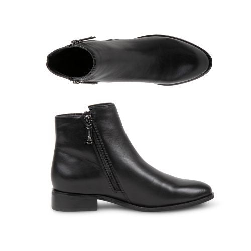 Profile and top view of the Carly ankle boot. Features a black inside zipper. 