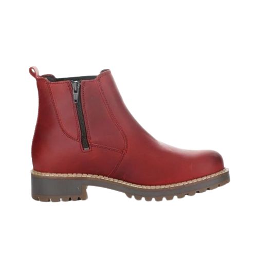 Profile view of red leather Chelsea boot with inside zipper and brown outsole.