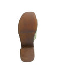 Bottom view of marly heeled slide sandal showing brown outsole minimum tred