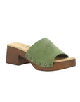 Marly slide sandal with green suede leather upper and brown block heel outsole. Tan footbed with brand logo detailing. Upper is attached to outsole with six silver rivets 