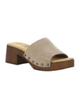 Marly slide sandal with soft grey suede leather upper and brown block heel outsole. Tan footbed with brand logo detailing. Upper is attached to outsole with six silver rivets 