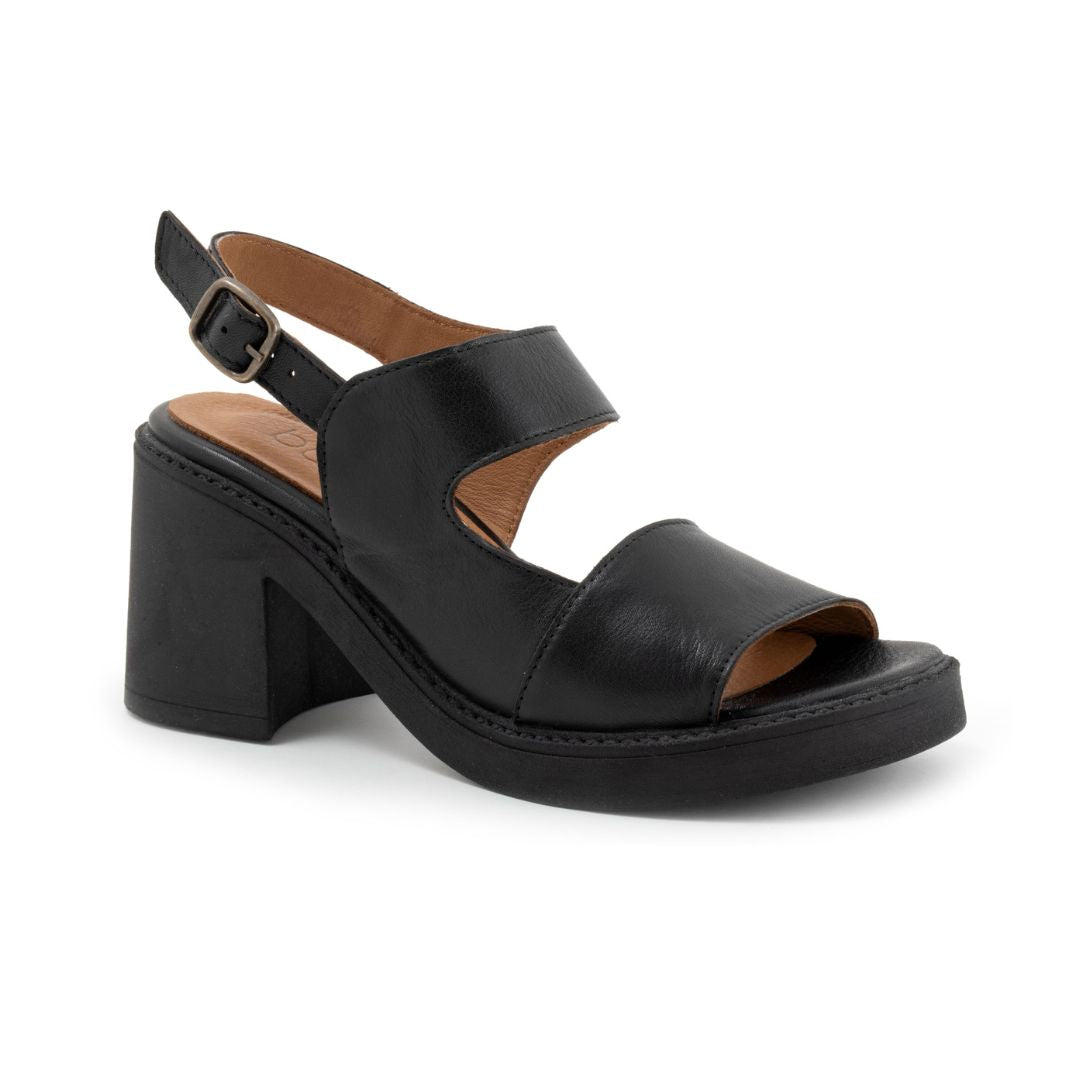 Black leather heeled sandal with platform outsole. Features an adjustable backstrap with pewter buckle.