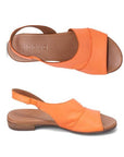 Top and profile view of Tansing sandal in apricot. Displays asymmetric cut. 