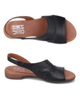 Top and profile view of Tansing sandal in black. 