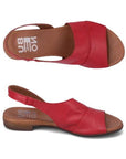 Top and profile view of Tansing sandal in red. 