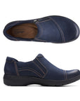 Top and side view of Carleigh Ray in navy. Brown insole with Clarks branding is visible. Shoe features blue elastic goring for easy on and off. 