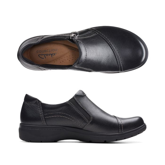 Top and profile view of Carleigh Ray in black. Brown insole with Clarks branding is visible. Shoe features black elastic side panel for easy on and off. 