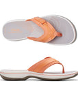 Top and profile view of Breeze Sea sandal in tangerine. Clarks branding is visible on footbed. 