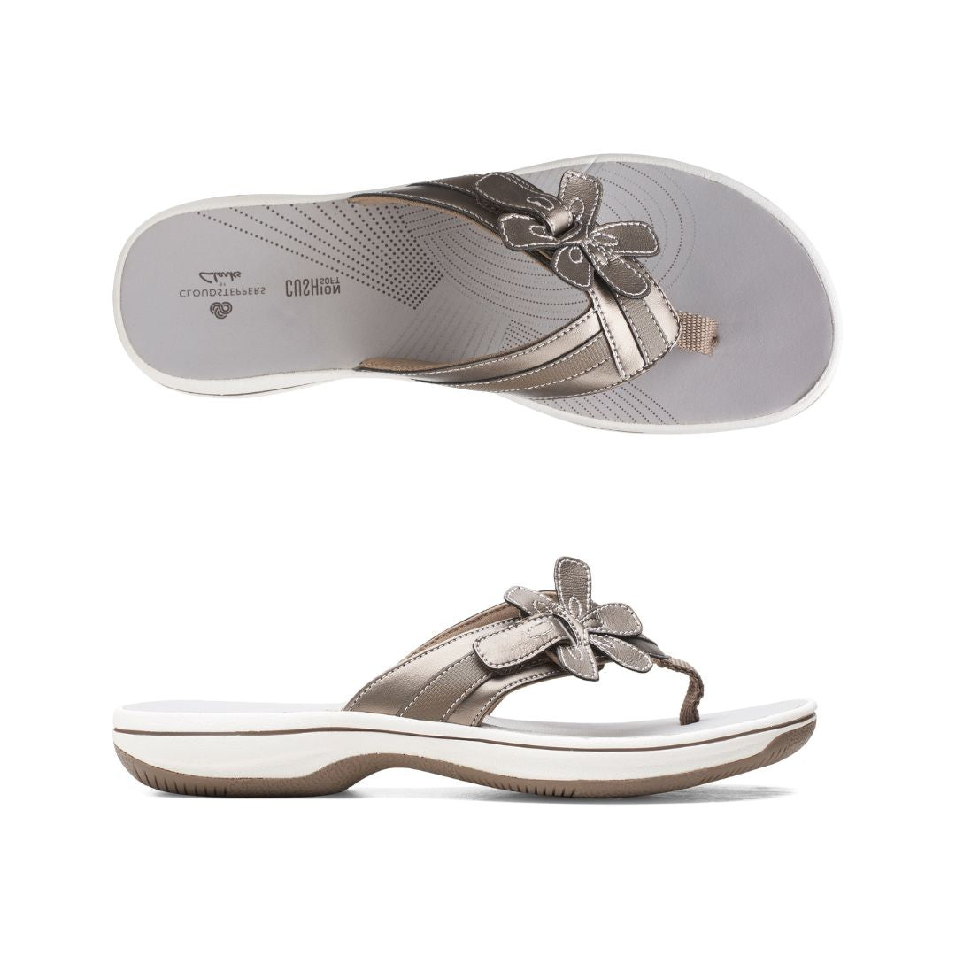 Top and profile view of Breeze Floral sandal in pewter. Clarks branding is visible on footbed. 