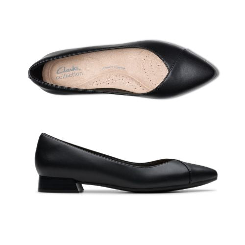 Top and profile view of Natalyn Wish flat in black. A pointed toe ballet flat with a low stacked heel. Clarks branding is visible on the insole. 