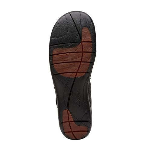 Black and brown textured outsole of UNLoop Mary Jane. 