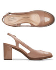 Top and profile view of Bayla Joy in beige. A closed toe pump with side cutouts and a slingback heel. 