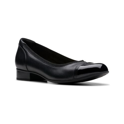 Black leather ballet flat with slight stacked heel and patent toe. 