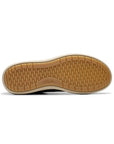 Beige and white outsole of Nalle sneaker in black. Rubber outsole with tread and small Clarks logo.