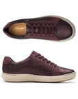 Top and profile view of Nalle sneaker in wine. Insole has Clarks logo visible. 