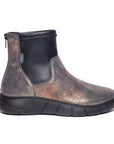 Wedge ankle boot with metallic burnished purple leather upper and black paneling. Zipper at the back of the ankle. The low wedge outsole is black.