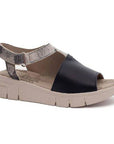 Wedge sandal with grey and black leather upper and off white wedge outsole. Asymmetrical upper features adjustable ankle strap.