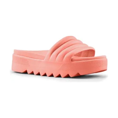 Pool Party Slide Sandal in Coral. A solid colour, light pink sandal with a 1.5 inch platform outsole, which has deep grooves. 