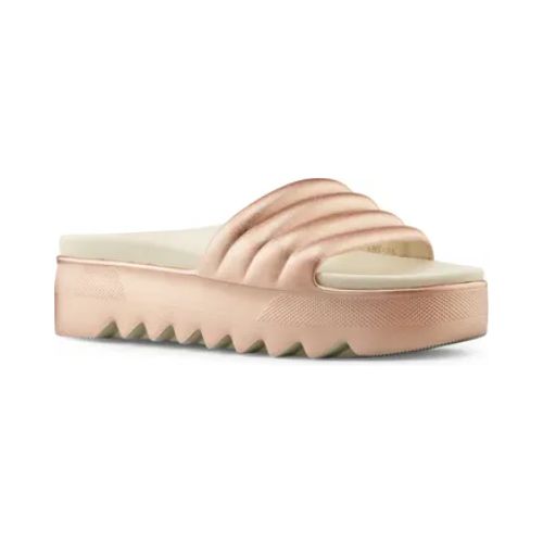Pool Party Slide Sandal in Rose Metallic. A rose gold sandal with a 1.5 inch platform outsole, designed with deep grooves. Footbed is taupe. 