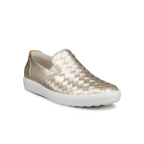 An Ecco Slip-On Sneaker with gold thatched appearance with a smooth leather gold heel and a white outsole. 