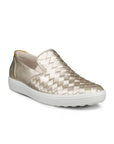 An Ecco Slip-On Sneaker with gold thatched appearance with a smooth leather gold heel and a white outsole. 