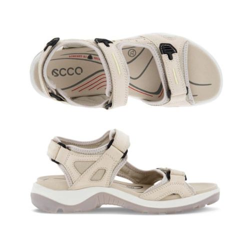 A pair of Ecco Yucatan light and dark tan nubuck sandals with black accents on velcro heel, instep and toe straps. Footbed is tan, midsole is white, and outsole are grey.