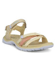 An Ecco walking sandal with straw uppers in accenting pink toe strap in between 2 straw toe straps, velcro heel, instep and toe straps. The midsole is yellow with a white outsole.