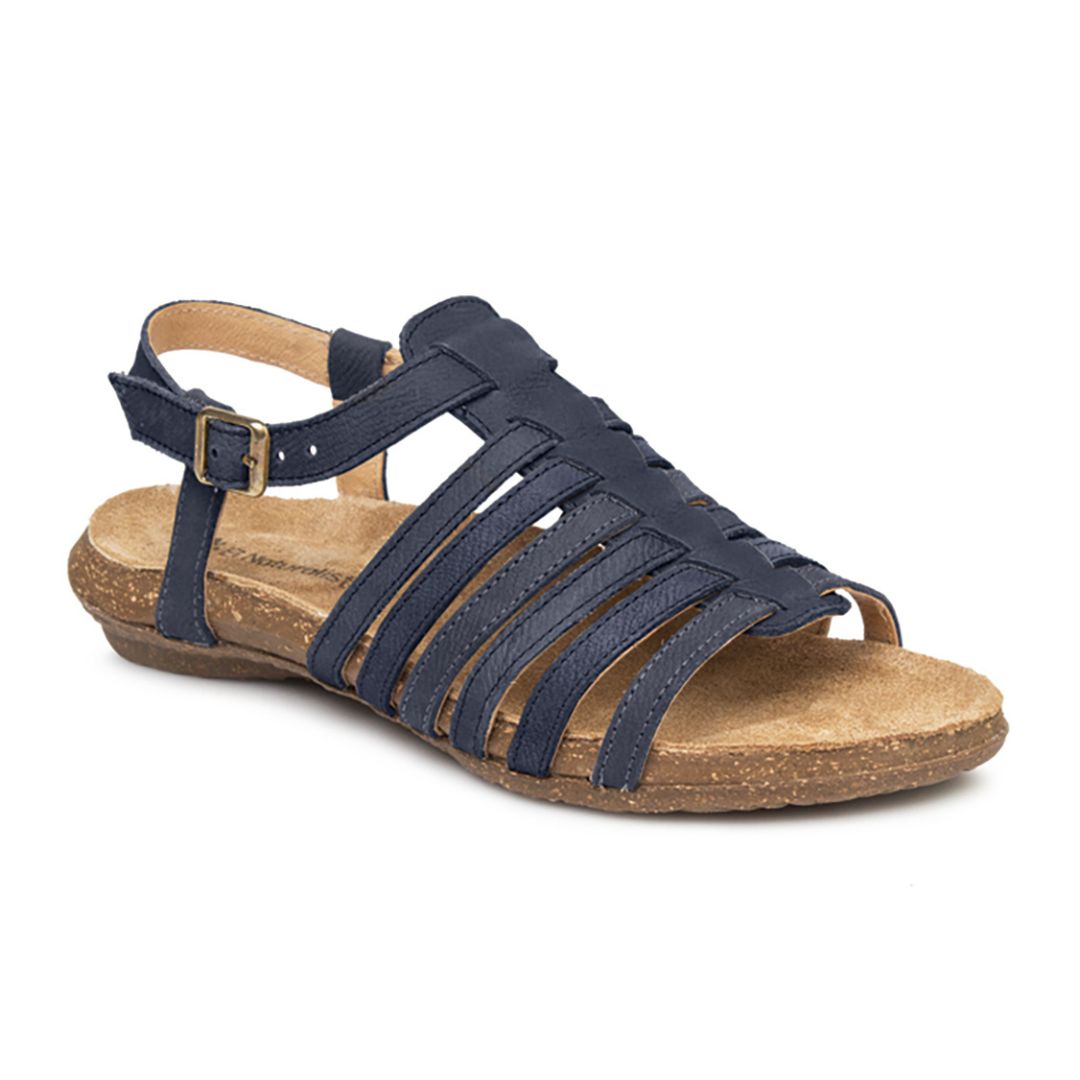 N5056 Backstrap Sandal in Ocean. A strappy sandal with a navy nubuck upper, a cork midsole, and a brown rubber outsole. Buckle is fitted with gold hardware. 