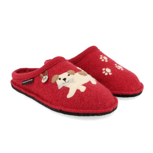 Open-back slippers with a red wool upper and a black outsole. On one slipper, there is a beige dog with a bone, as well as the Haflinger logo. On the other slipper, there are felt paw prints. 