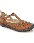 A Mary-Jane Flat with floral cut-out design, adjustable strap, and durable outsole.