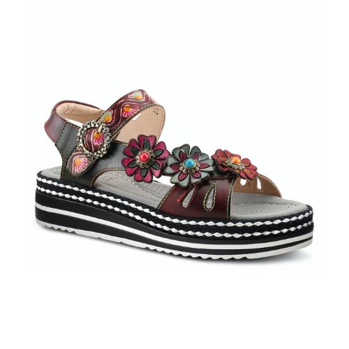 Black leather sandals with a multicoloured purple upper, floral buttons, and a black and white layered platform outsole. 