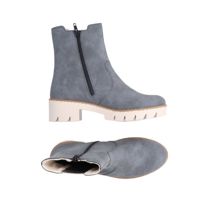 A pair of Rieker blue Chelsea boots with side zipper, white lining and a platform lugged white outsole.