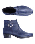 A pair of navy Rieker ankle boots with circle buckle detail, side zipper, light black felt lining  and low black stacked heel.