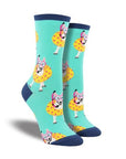 Light blue socks with dark blue accents featuring dogs with snorkels in floaty tubes