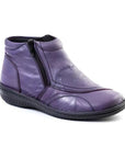 Purple ankle boot with soft textured upper and side zipper.